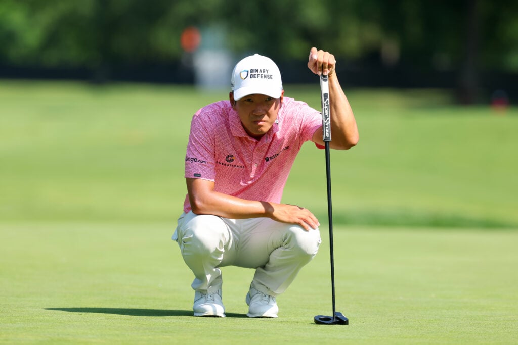 Michael Kim lines up a putt during the first round of the Rocket Classic