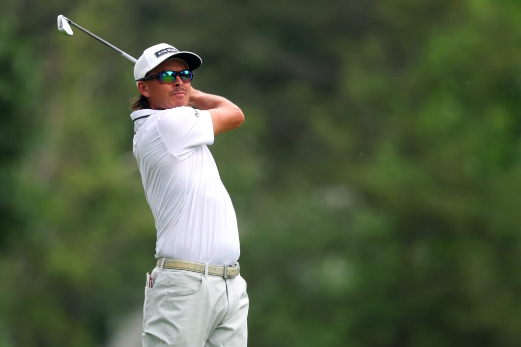 Rickie Fowler hits an approach shot during the first round of the Rocket Classic