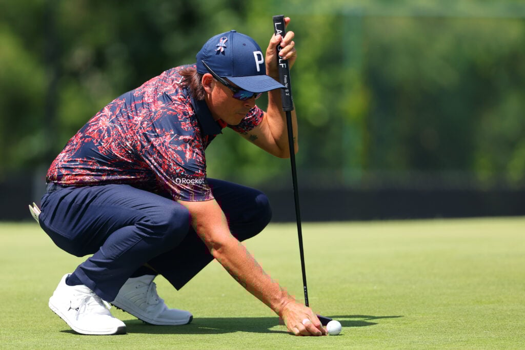 Rickie Fowler lines up a putt on the eighth green during round two of the Rocket Classic