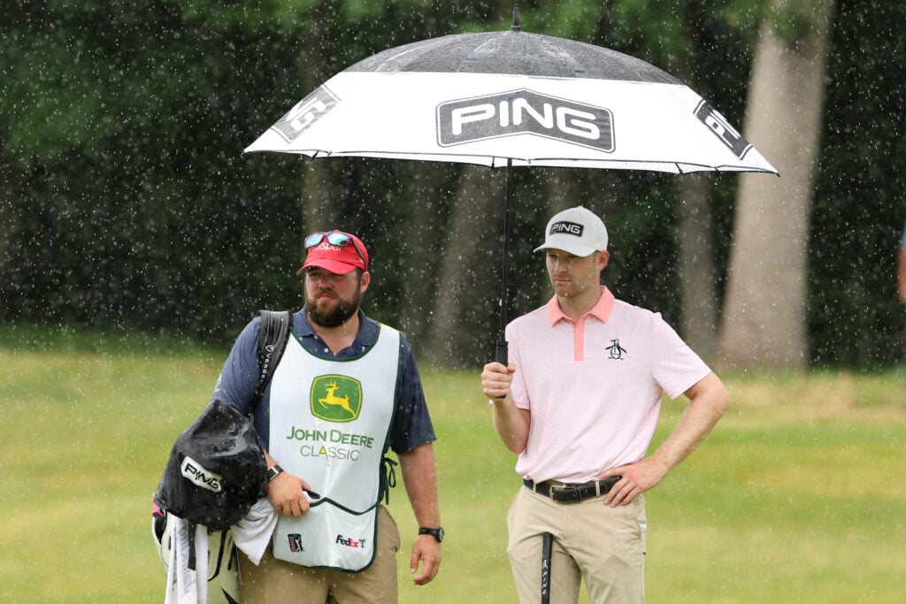 Brian Campbell stands alongside his caddie during the final round of the John Deere Classic