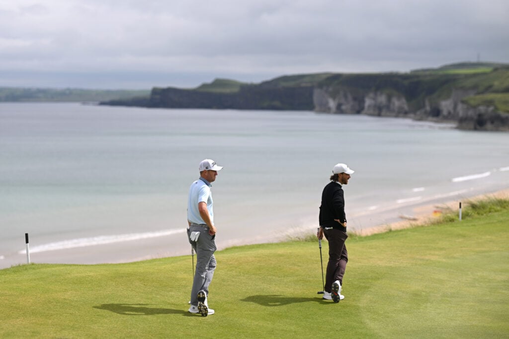 Justin Thomas and Tommy Fleetwood look across the fifth green during The Open Championship
