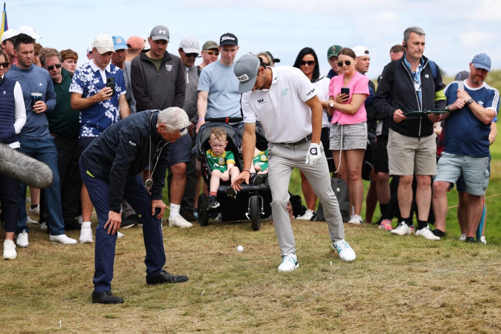 Joaquin Niemann takes a drop during the second round of The Open Championship at Royal Portrush