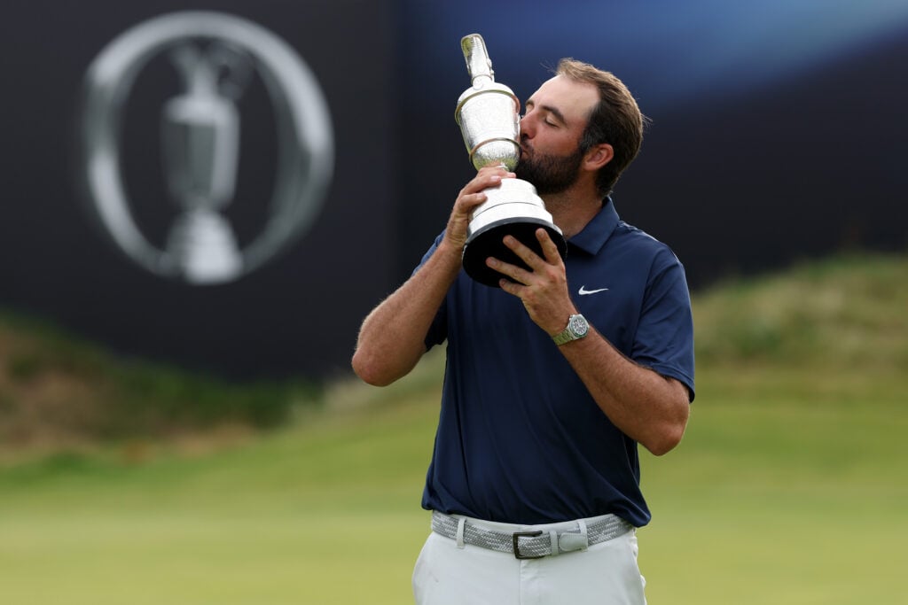 Scottie Scheffler kisses the Claret Jug after winning The Open Championship at Royal Portrush