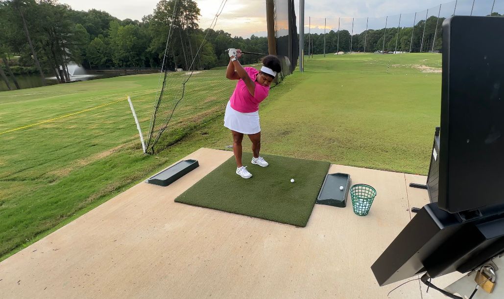 A member of TWIG KIDZ practices her swing. (Spectrum News 1/Sydney McCoy)
