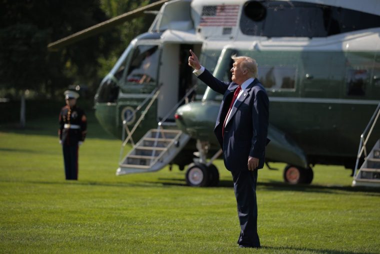 WASHINGTON, DC - JULY 25: U.S. President Donald Trump points up as he walks across the South Lawn before boarding Marine One and departing the White House on July 25, 2025 in Washington, DC. Trump is traveling to his Balmedie golf courses in Scotland this week. (Photo by Chip Somodevilla/Getty Images)