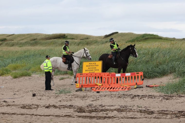 Police outside the perimeter of Turnberry golf course in South Ayrshire, ahead of the arrival of US President Donald Trump to begin his five-day private trip to the country. Picture date: Friday July 25, 2025. PA Photo. The US president is expected to head over to his Menie golf course in Aberdeenshire before opening up a new course dedicated to his Scottish mother, who grew up on the Isle of Lewis. Photo credit should read: Robert Perry/PA Wire