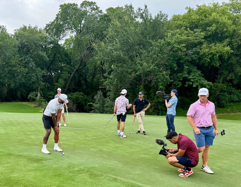 Dallas Cowboys quarterback Dak Prescott readies to putt with the team from Good Good Golf as...