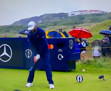 Rahm has words with a fan after the fan whistled prior to his swing