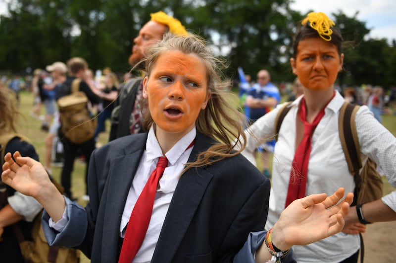 Protesters wore orange face makeup.