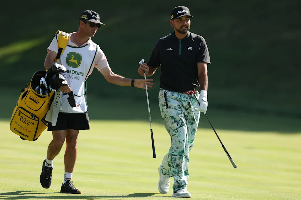 Jason Day and his caddie Luke Reardon look on from the 15th hole during the second round of the 2025 John Deere Classic at TPC Deere Run.