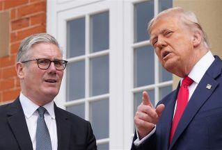 US President Donald Trump (R) and Britain's Prime Minister Keir Starmer (L) speak with members of the media prior to a bilateral meeting at the Trump Turnberry Golf Courses, in Turnberry south west Scotland on July 28, 2025. (Photo by Christopher Furlong / POOL / AFP) (Photo by CHRISTOPHER FURLONG/POOL/AFP via Getty Images)