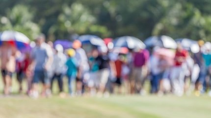 Blurry golf crowd