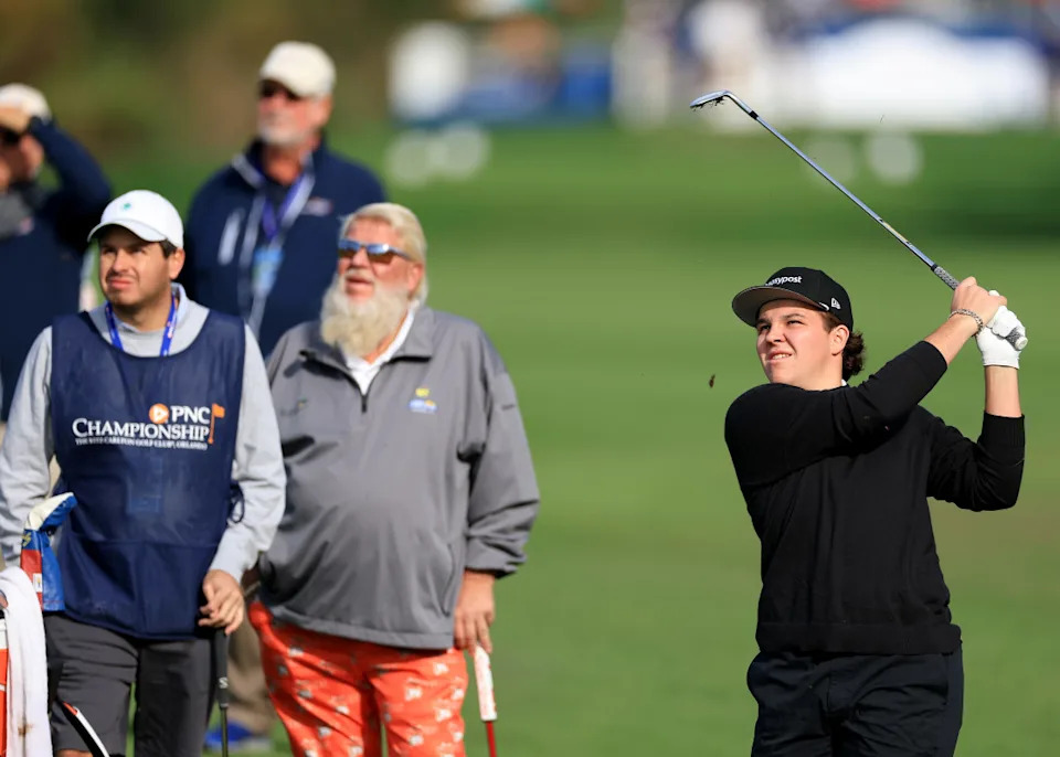 ORLANDO, FLORIDA - DECEMBER 18: John Daly II plays his second shot on the first hole watched by his father John Daly of The United States during the final round of the 2022 PNC Championship at The Ritz-Carlton Golf Club on December 18, 2022 in Orlando, Florida. (Photo by David Cannon/Getty Images)David Cannon&sol;Getty Images