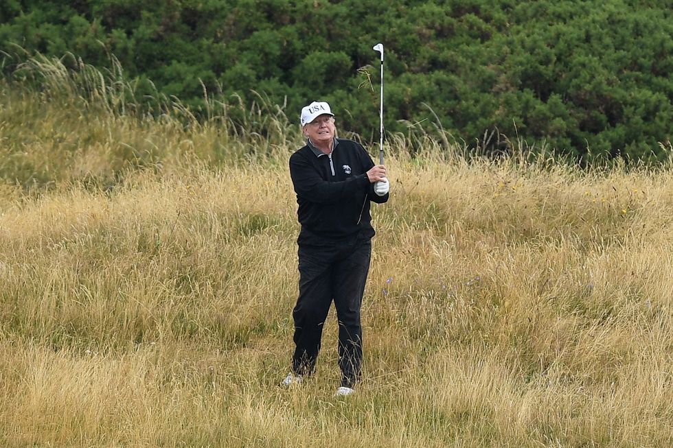 Donald Trump playing golf