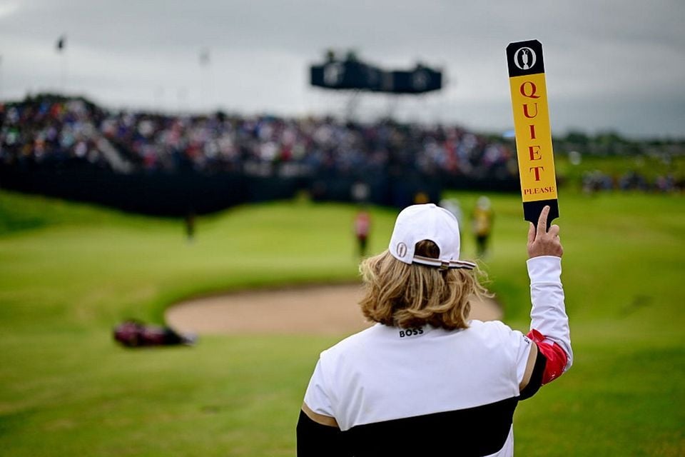 A marshal on the par-three 13th hole at Royal Portrush