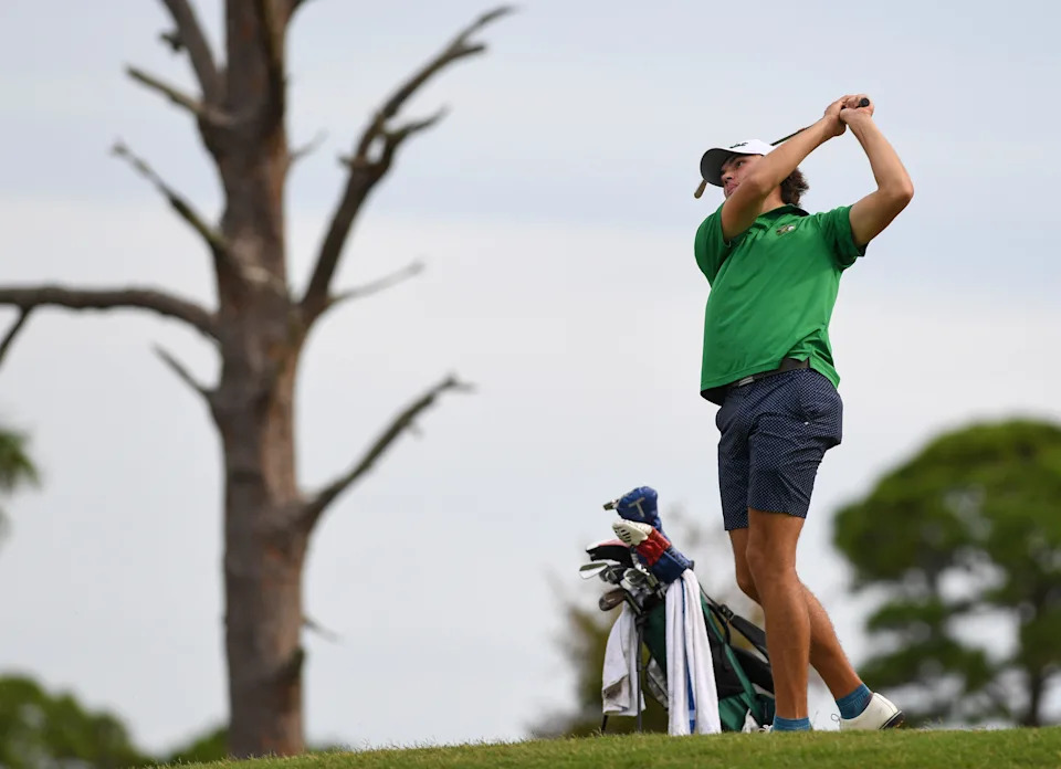 Jupiter’s Cameron Kuchar hits his tee shot on the sixth hole at Sandridge Golf Club, Monday, Oct. 28, 2024, in Indian River County during the District 7-3A meet.