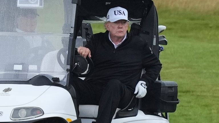 President Donald Trump steers a golf cart at the Trump Turnberry golf course in Turnberry, Scotland, Saturday, July 26, 2025.(AP Photo/Alastair Grant)