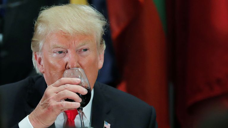 Donald Trump sips Diet Coke from a wine glass after a toast during a luncheon for world leaders at the United Nations in 2018. Pic: Reuters