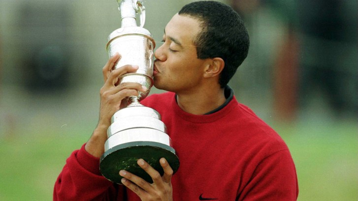 Tiger Woods kisses the 2000 British Open Championship Claret Jug trophy