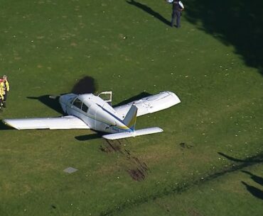 Two people escape serious injury after light plane crash lands on golf course in Sydney's Northern Beaches