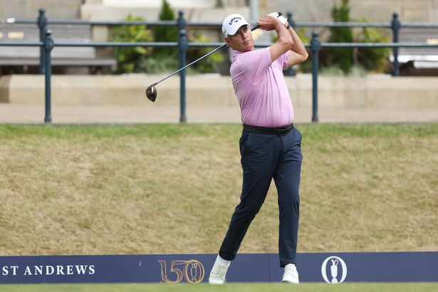 Ian Baker-Finch swings his club on the course