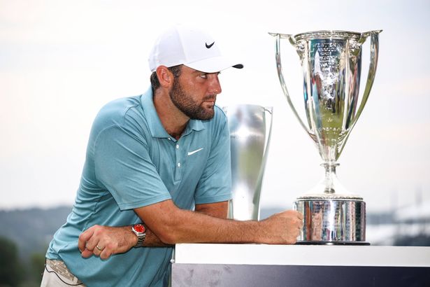 Scottie Scheffler of the United States looks on during the trophy ceremony on the 18th green after the final round of the BMW Championship