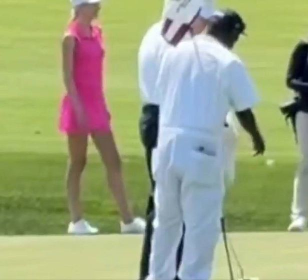 Trump was seen dragging a ball into the hole
