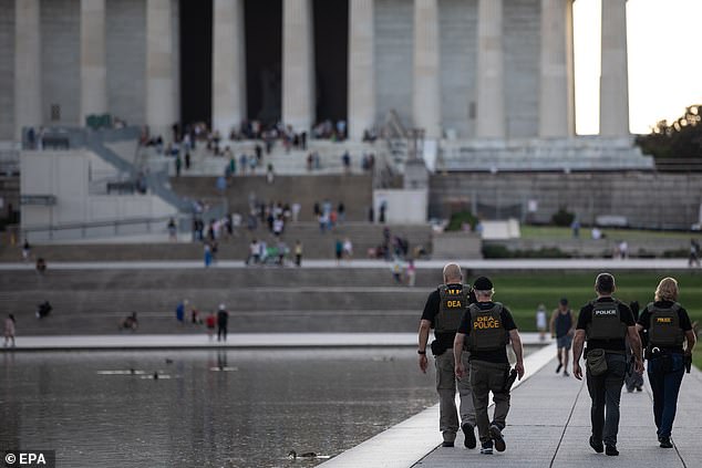 Trump federalized D.C. earlier this month, bringing in federal law enforcement agents to help crackdown on violent crime. Pictured: DEA agents join MPD officers patrolling near the Lincoln Memorial on August 14, 2025