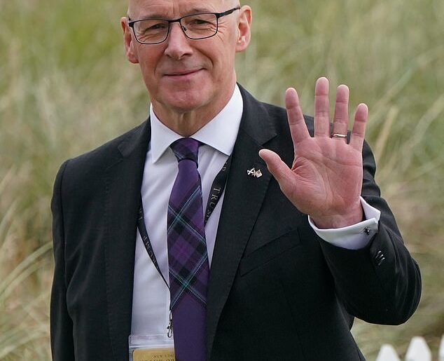 First Minister John Swinney arrives ahead of the opening of Donald Trump's new Aberdeenshire golf course last month