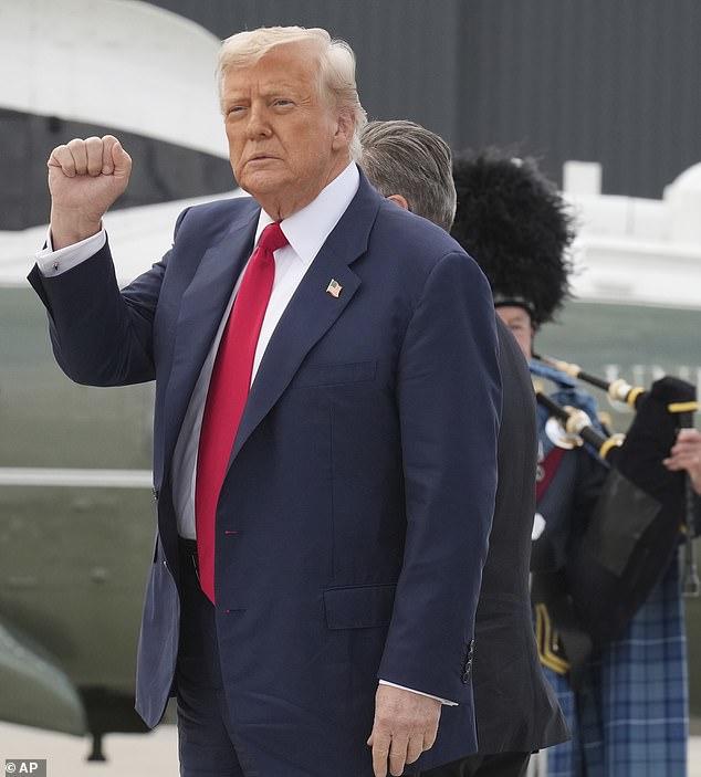 President Trump salutes onlookers after touching down at RAF Lossiemouth