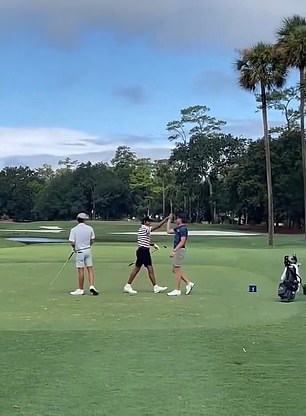 Woods, 16, celebrated with a high-five