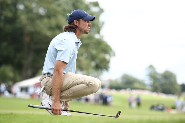 Tommy Fleetwood of England lines up a putt on the fifth green during the final round of the TOUR Championship 2025 at East Lake Golf Club on August 24, 2025
