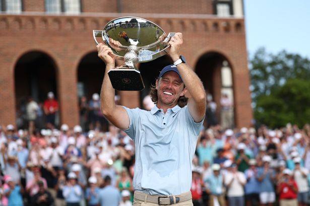 Tommy Fleetwood celebrates with the FedEx Cup