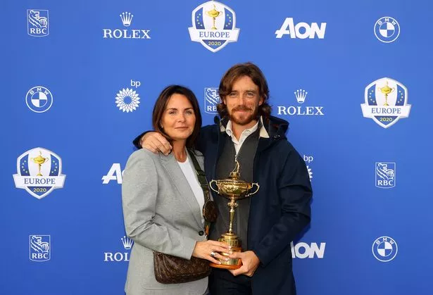 Tommy Fleetwood of Team Europe and wife Clare Fleetwood pose with the Ryder Cup Trophy before departing Heathrow Airport ahead of the 43rd Ryder Cup on September 20, 2021 in London, England.