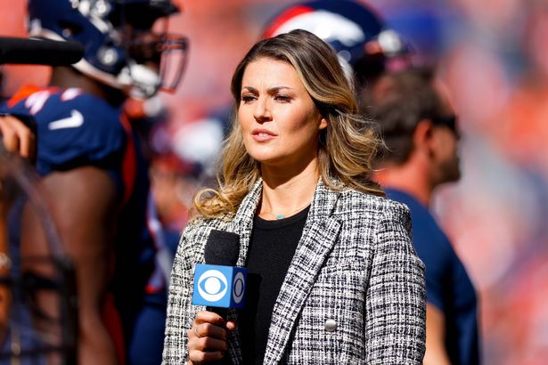 Amanda Balionis looks on