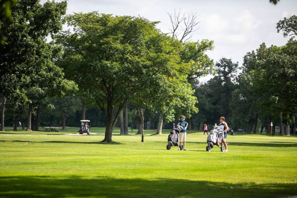 MIKAELA MACKENZIE / FREE PRESS
                                Jan Duncan (left) and Tracy Paluk head up the fairway while playing a round at Windsor Park Golf Course recently