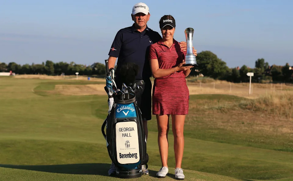 Georgia Hall of Great Britain poses with her father and caddy Wayne after winning the 2018 Women's British Open