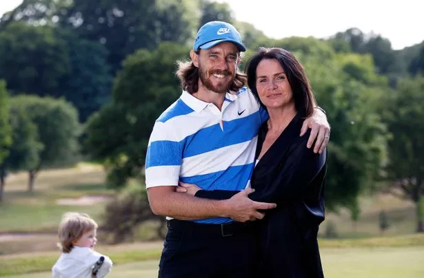 Tommy Fleetwood of England with his wife Clare after his practice session at Sandiway Golf Club