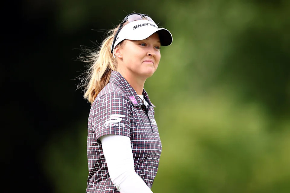 Brooke M. Henderson of Canada reacts to applause from fans as she walks up to the tenth green during the third round of the CPKC Women's Open 2025 at Mississauga Golf and Country Club on August 23, 2025 in Mississauga, Canada.
