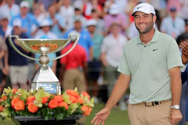 Scottie Scheffler with the FedEx Cup trophy