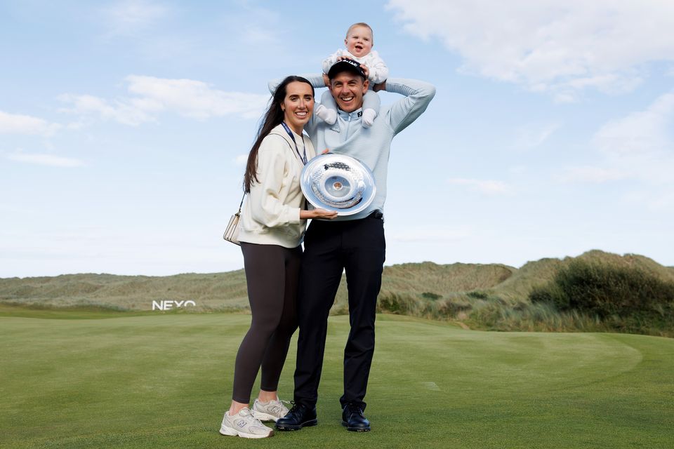 Grant Forrest with wife Christy and son Spencer after winning the Nexo Championship at Trump International Golf Links in Scotland. Photo: Getty Images