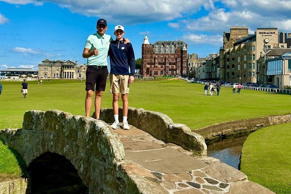 Eilgin Michael with dad Glen on the famous Swilcan Bridge on the Old Course at St Andrew’s