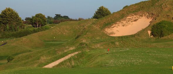 ROCK, CORNWALL - MAY 23:  The par 4, 6th hole with the 'Himalaya' bunker at the St Enodoc Golf Club, on May 22, in Rock, England