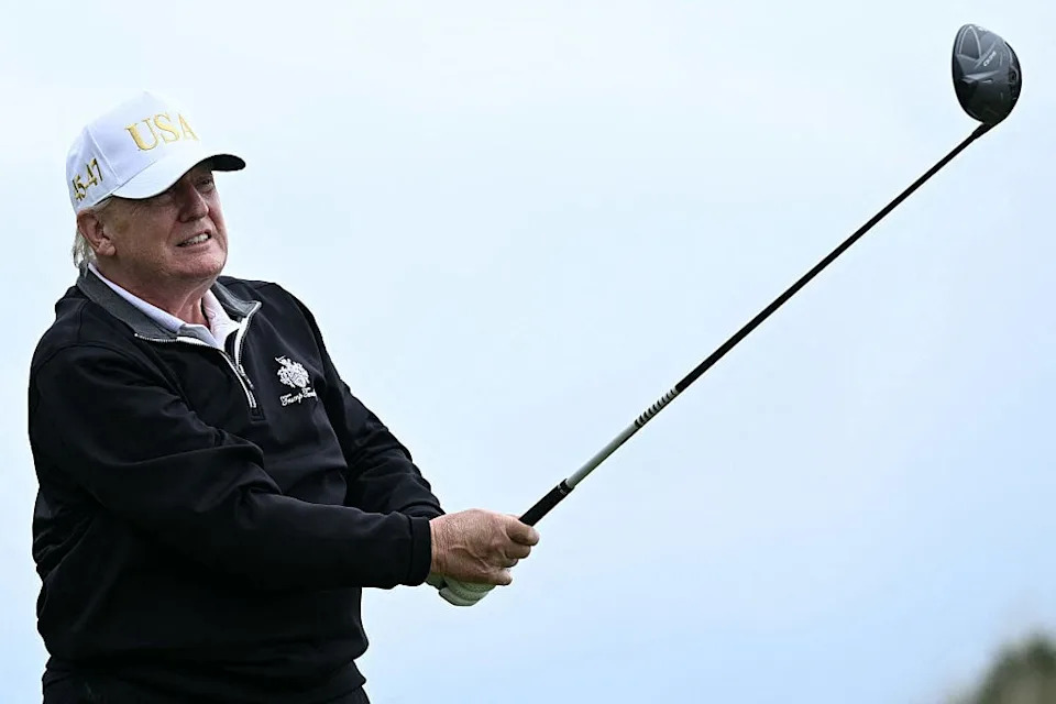 US President Donald Trump watches his drive after playing from the first tee to officially open the Trump International Golf Links course in Balmedie, Aberdeenshire, north east Scotland on July 29, 2025. / BRENDAN SMIALOWSKI / AFP via Getty Images