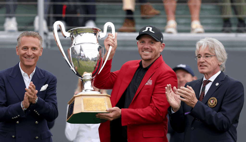 Matt Wallace holds the Omega European Masters trophy
