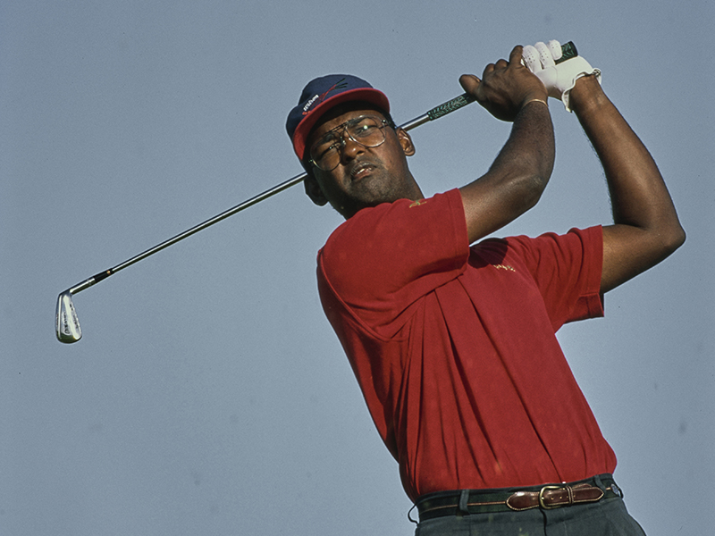 Vijay Singh in the finish position with an iron
