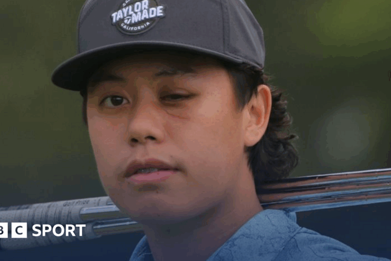 Jeffrey Guan poses with a golf club