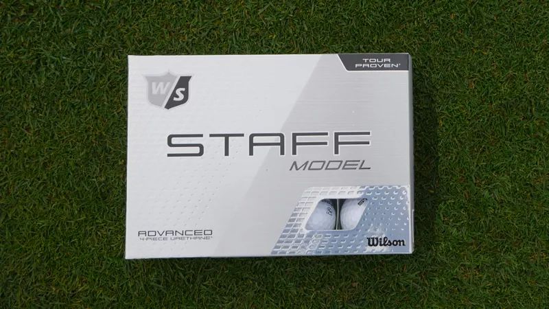 Wilson Staff Model Ball resting on the greens