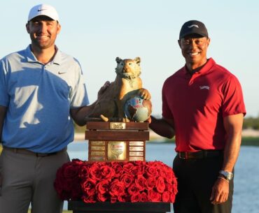 Scottie Scheffler (left) and Tiger Woods pose with the trophy after Scheffler won Woods' Hero World Challenge. That money does not count toward Scheffler's career winnings; he's third behind Woods and Rory McIlroy but could soon pass them both.