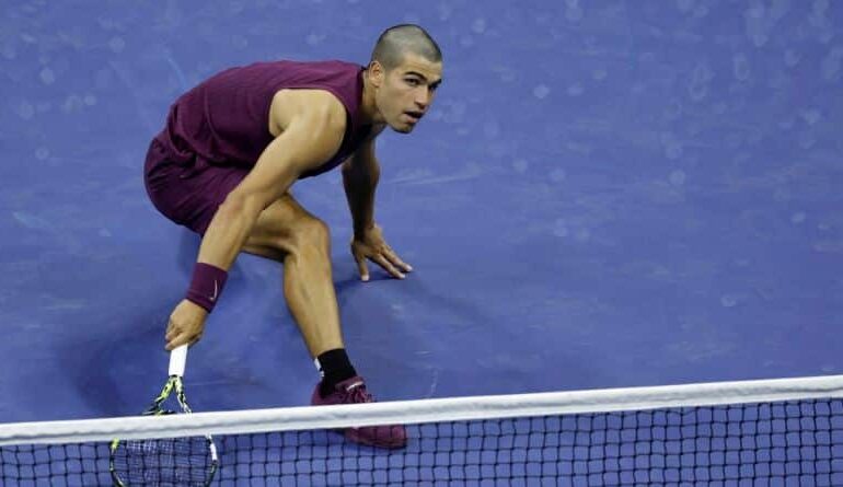 Carlos Alcaraz, of Spain, returns a shot to Reilly Opelka, of the United States, during the first round of the U.S. Open tennis championships, Monday, Aug. 25, 2025, in New York. (AP Photo/Adam Hunger)
